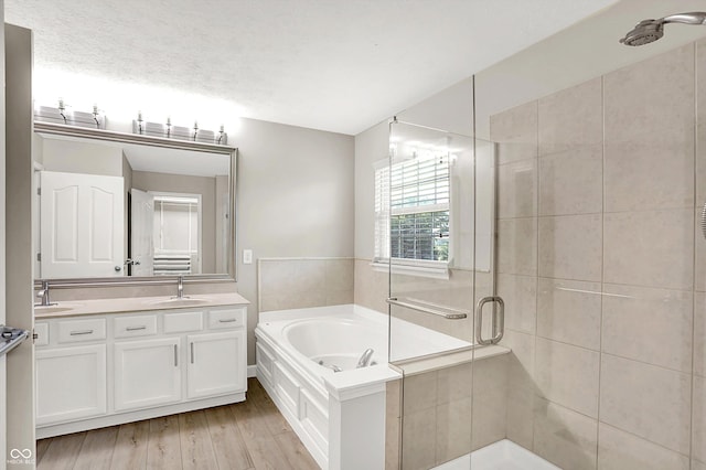 3345 Kilkenny Cir, Carmel, IN 46032 - full bathroom with a shower stall, double vanity, a bath, and wood finished floors