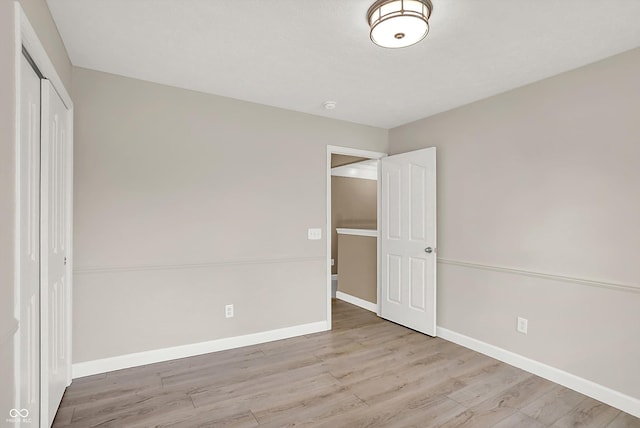3345 Kilkenny Cir, Carmel, IN 46032 - unfurnished bedroom with a closet and wood finished floors