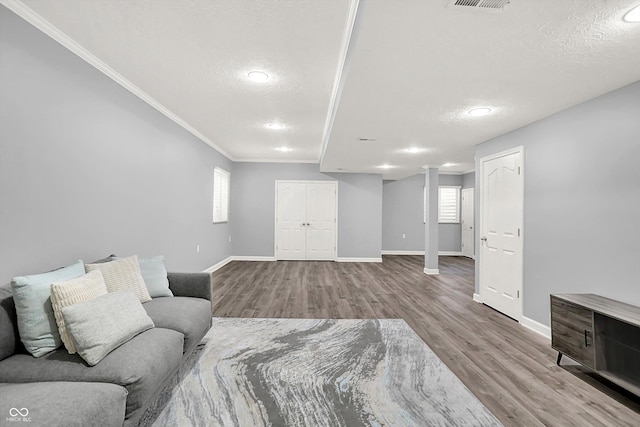 3345 Kilkenny Cir, Carmel, IN 46032 - living area featuring a textured ceiling, healthy amount of natural light, crown molding, wood finished floors, and recessed lighting