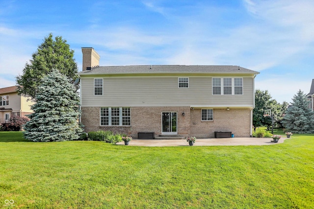 3345 Kilkenny Cir, Carmel, IN 46032 - back of property featuring a patio area and a lawn