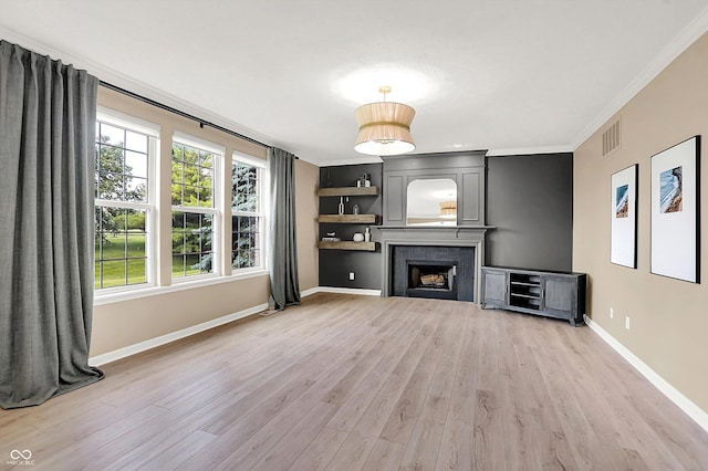 3345 Kilkenny Cir, Carmel, IN 46032 - unfurnished living room with light wood finished floors, crown molding, and a fireplace