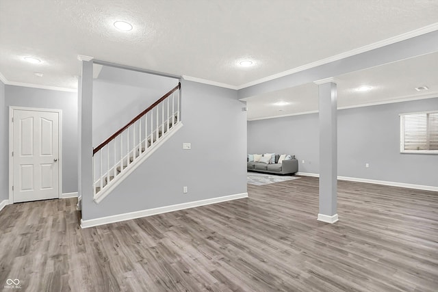 3345 Kilkenny Cir, Carmel, IN 46032 - finished basement featuring stairs, wood finished floors, ornamental molding, recessed lighting, and a textured ceiling