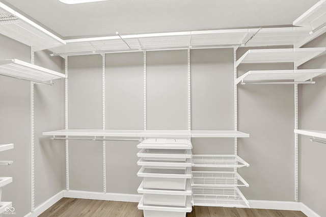 3345 Kilkenny Cir, Carmel, IN 46032 - walk in closet featuring wood finished floors