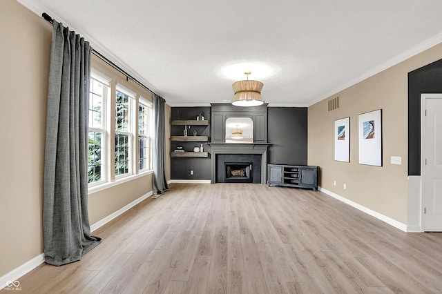 3345 Kilkenny Cir, Carmel, IN 46032 - unfurnished living room featuring light wood finished floors, crown molding, and a fireplace
