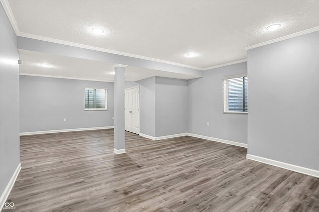 3345 Kilkenny Cir, Carmel, IN 46032 - below grade area with plenty of natural light, wood finished floors, a textured ceiling, recessed lighting, and ornamental molding
