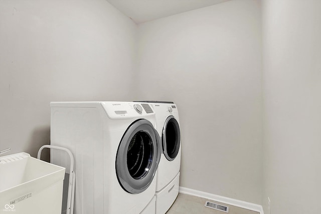 3345 Kilkenny Cir, Carmel, IN 46032 - washroom featuring separate washer and dryer and light tile patterned floors