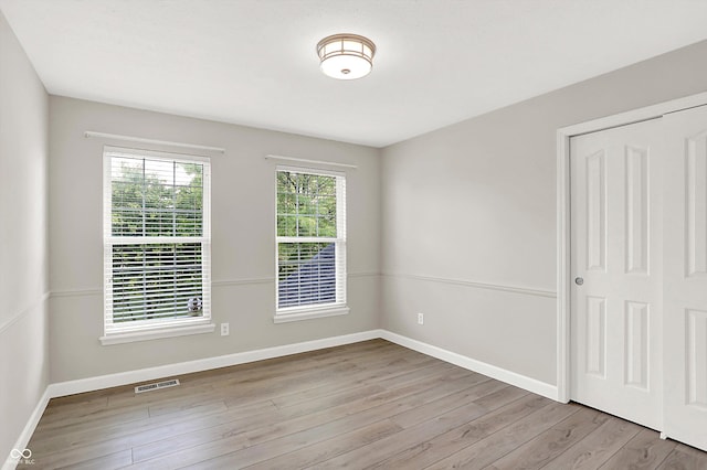 3345 Kilkenny Cir, Carmel, IN 46032 - spare room featuring baseboards and light wood finished floors