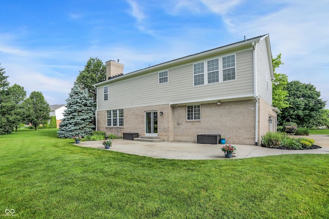 3345 Kilkenny Cir, Carmel, IN 46032 - rear view of property with a patio, a chimney, a yard, brick siding, and entry steps