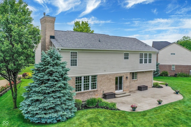 3345 Kilkenny Cir, Carmel, IN 46032 - back of property with a patio, a lawn, a chimney, and brick siding