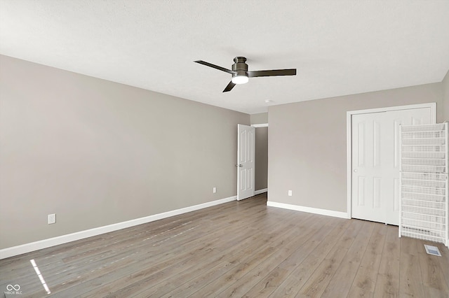 3345 Kilkenny Cir, Carmel, IN 46032 - unfurnished bedroom with light wood finished floors and a ceiling fan