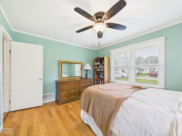 3809 N Glenwood Ave, Muncie, IN 47304 - bedroom with wood finished floors, ornamental molding, and a ceiling fan