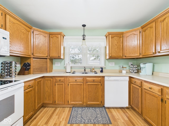 3809 N Glenwood Ave, Muncie, IN 47304 - kitchen featuring white appliances, light wood-type flooring, light countertops, pendant lighting, and brown cabinets