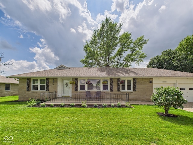 3809 N Glenwood Ave, Muncie, IN 47304 - ranch-style house featuring stone siding, a front yard, an attached garage, and roof with shingles