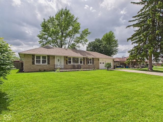 3809 N Glenwood Ave, Muncie, IN 47304 - ranch-style home with a garage, driveway, a front lawn, stone siding, and a shingled roof