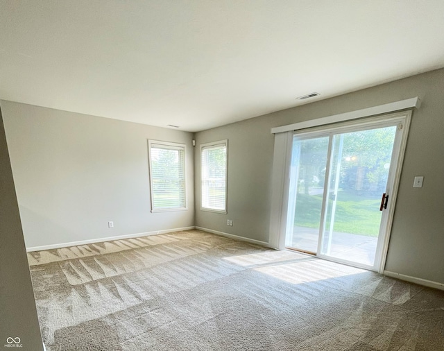 1173 Carlton Ct, Greenwood, IN 46143 - carpeted spare room featuring plenty of natural light