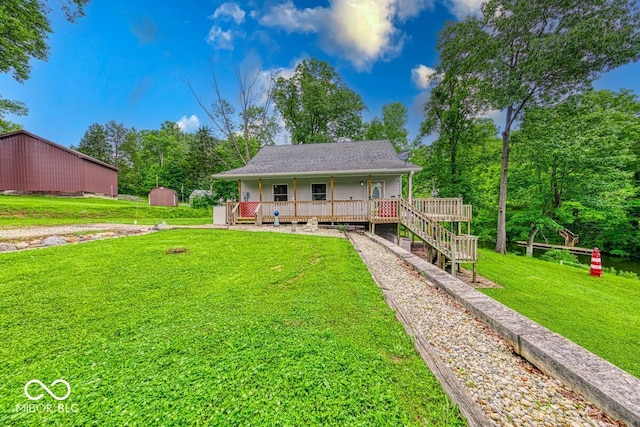 8635 S Providence Dr, Nineveh, IN 46164 - rear view of house with a lawn, a porch, and a storage unit