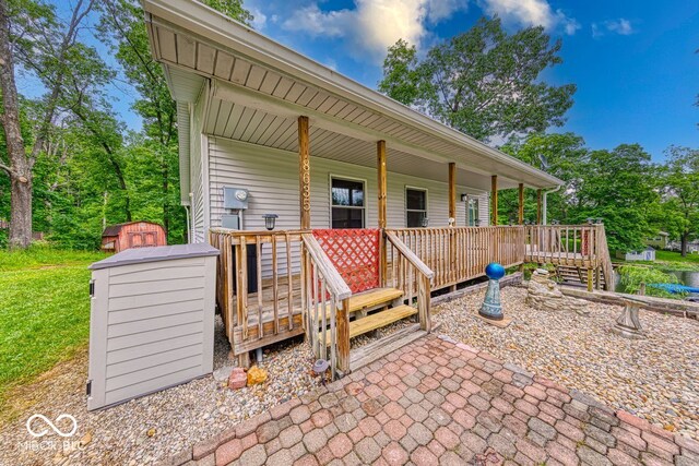 8635 S Providence Dr, Nineveh, IN 46164 - covered porch featuring a storage unit