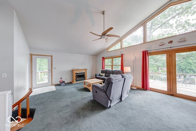 8635 S Providence Dr, Nineveh, IN 46164 - living room featuring carpet, ceiling fan, high vaulted ceiling, and a glass covered fireplace