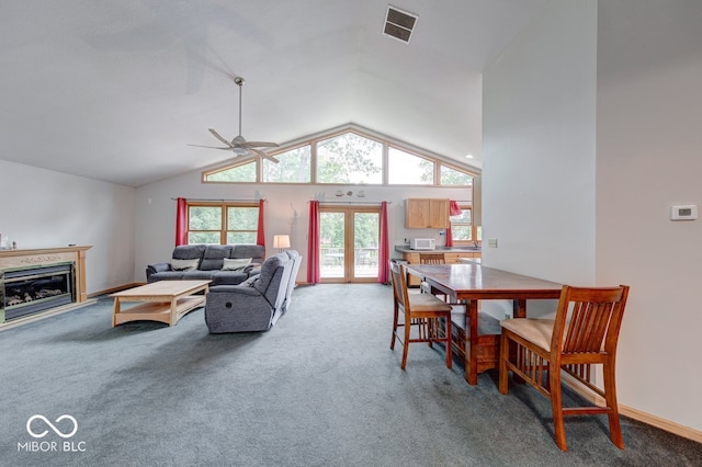 8635 S Providence Dr, Nineveh, IN 46164 - living area with light colored carpet, ceiling fan, vaulted ceiling, and a glass covered fireplace
