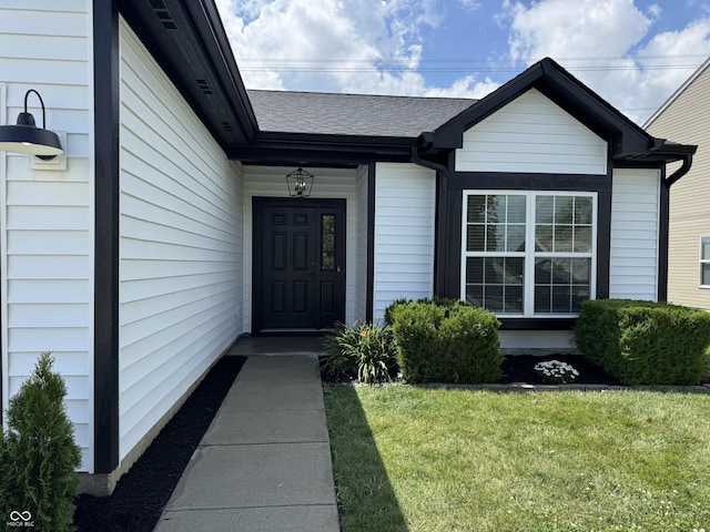 4726 Deacon Ln, Indianapolis, IN 46237 - doorway to property featuring a yard and a shingled roof