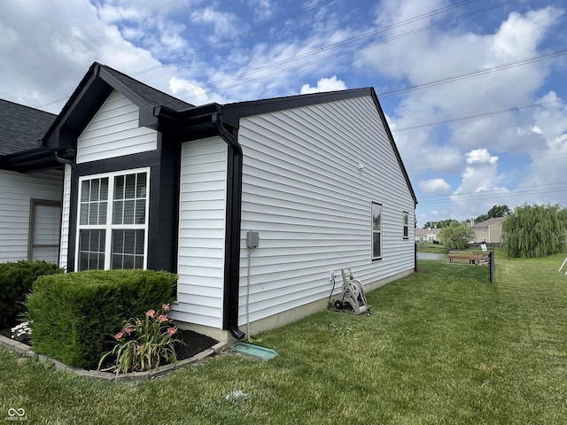 4726 Deacon Ln, Indianapolis, IN 46237 - view of home's exterior with a yard and roof with shingles
