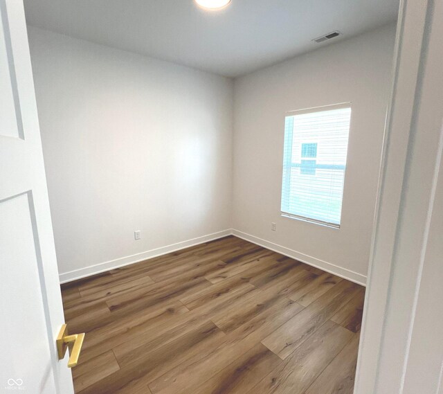 4726 Deacon Ln, Indianapolis, IN 46237 - spare room featuring dark wood-style flooring and baseboards