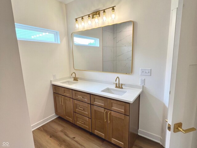 4726 Deacon Ln, Indianapolis, IN 46237 - full bathroom with double vanity and wood finished floors