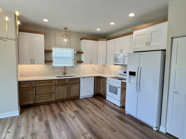 4726 Deacon Ln, Indianapolis, IN 46237 - kitchen with white appliances, open shelves, white cabinetry, recessed lighting, and wood finished floors