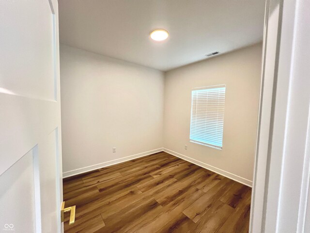 4726 Deacon Ln, Indianapolis, IN 46237 - empty room with dark wood-type flooring and baseboards