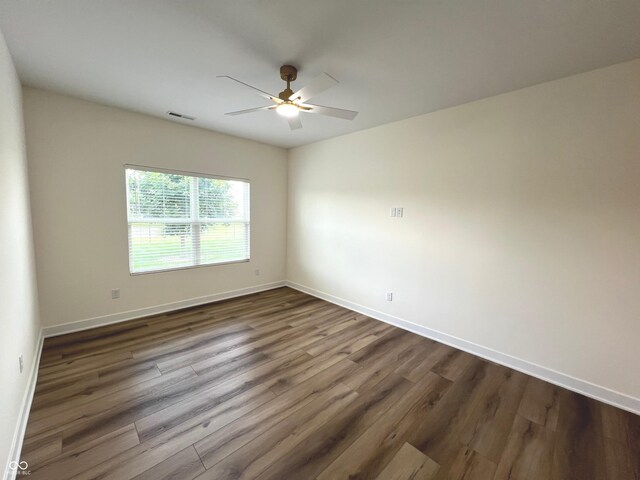 4726 Deacon Ln, Indianapolis, IN 46237 - spare room with a ceiling fan and dark wood-style floors