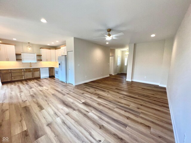4726 Deacon Ln, Indianapolis, IN 46237 - unfurnished living room with a ceiling fan, light wood-type flooring, and recessed lighting