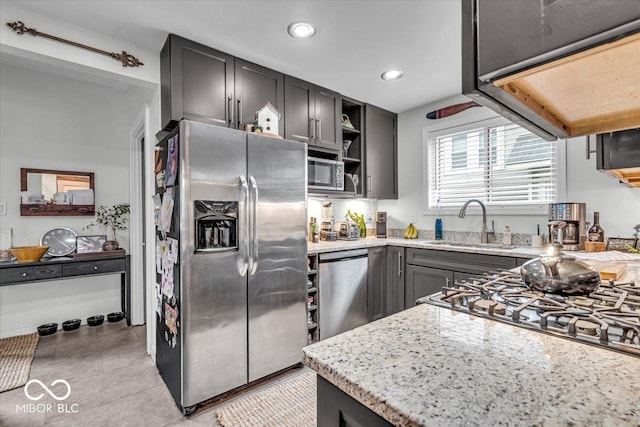 4046 N Park Ave, Indianapolis, IN 46205 - kitchen featuring stainless steel appliances, light stone countertops, open shelves, recessed lighting, and light tile patterned floors