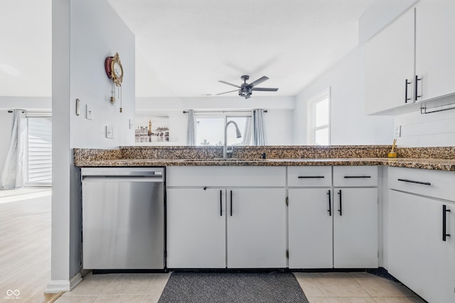 8158 Shorewalk Dr Unit F, Indianapolis, IN 46236 - kitchen featuring dishwasher, a ceiling fan, dark stone counters, and light tile patterned flooring