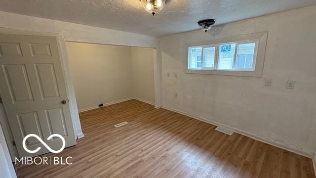 252 Ringwood Way, Anderson, IN 46013 - empty room featuring wood finished floors and a textured ceiling