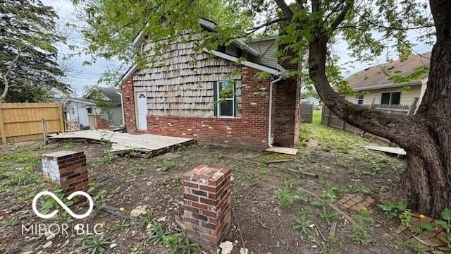 252 Ringwood Way, Anderson, IN 46013 - view of side of property featuring brick siding and a wooden deck