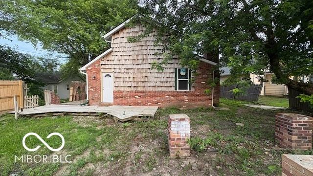252 Ringwood Way, Anderson, IN 46013 - back of house featuring a wooden deck and brick siding