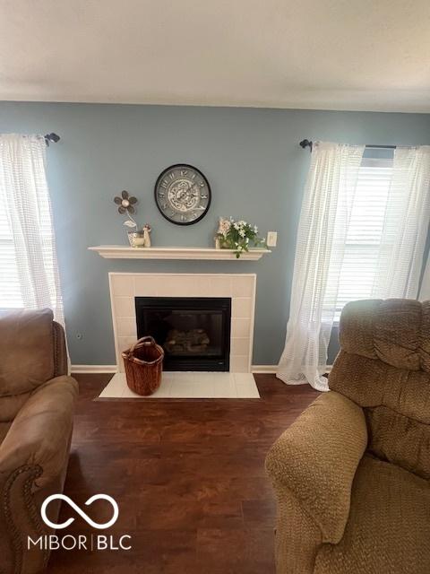 2231 Abbey St, Brownsburg, IN 46112 - living area with a tiled fireplace and wood finished floors
