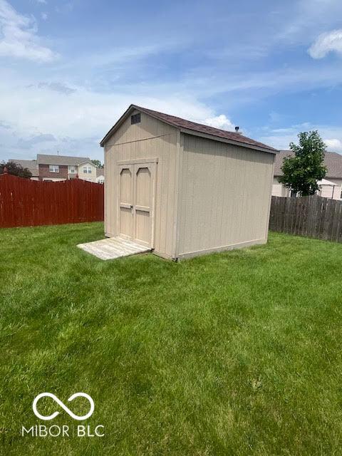 2231 Abbey St, Brownsburg, IN 46112 - view of shed featuring a fenced backyard