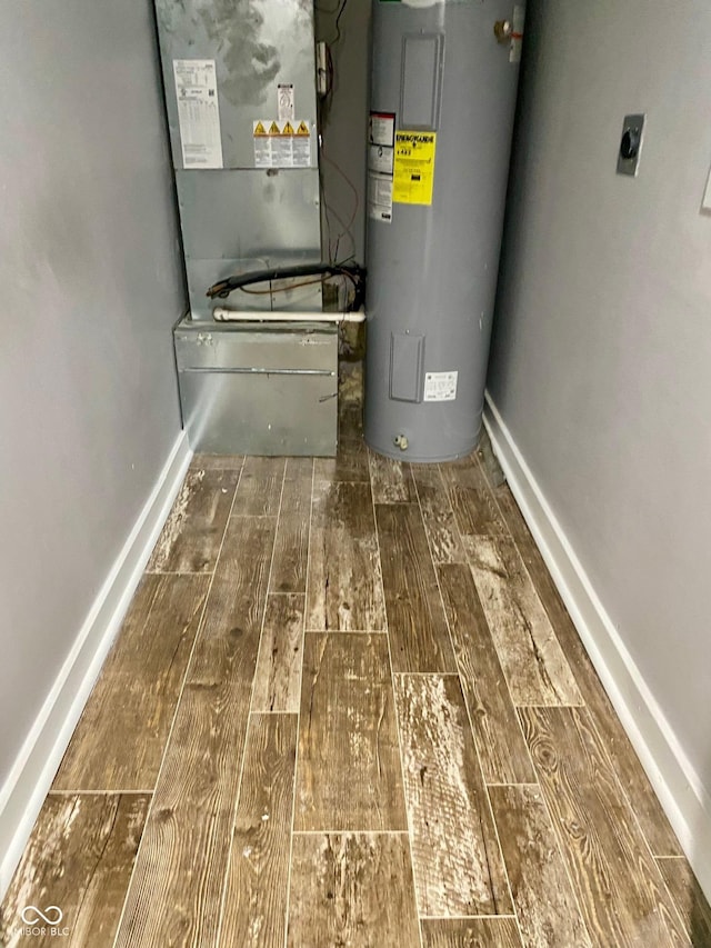 3464 N Bancroft St, Indianapolis, IN 46218 - utility room featuring electric water heater and heating unit