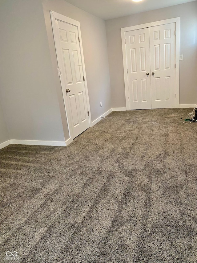 3464 N Bancroft St, Indianapolis, IN 46218 - unfurnished bedroom featuring carpet floors and a closet