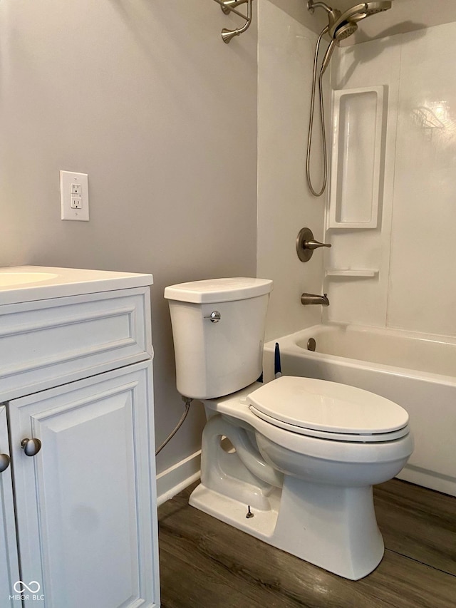 3464 N Bancroft St, Indianapolis, IN 46218 - bathroom featuring wood finished floors, bathtub / shower combination, and vanity