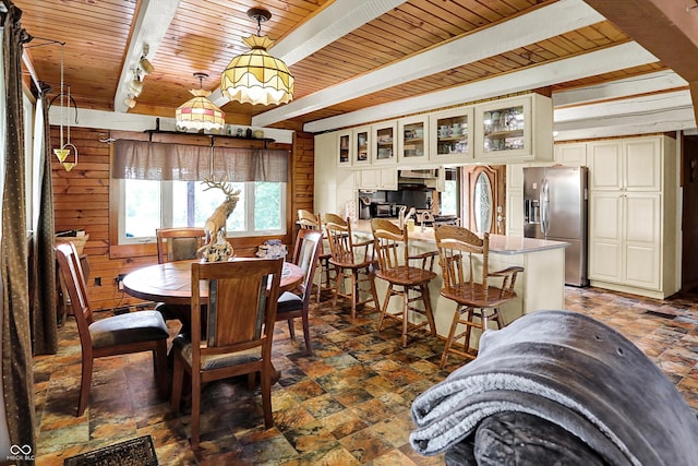 1155 Cope Rd, Martinsville, IN 46151 - dining space featuring a wooden ceiling with exposed beams, stone finish floors, and wooden walls
