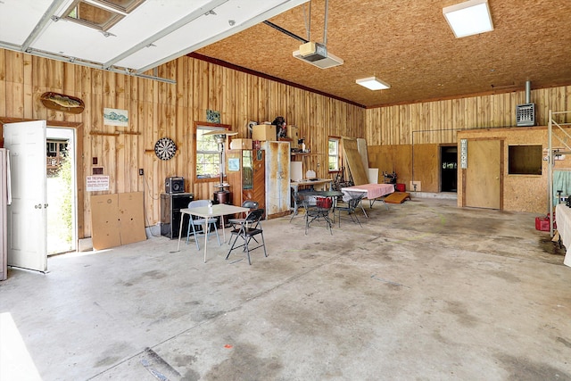 1155 Cope Rd, Martinsville, IN 46151 - garage featuring wood walls and a garage door opener