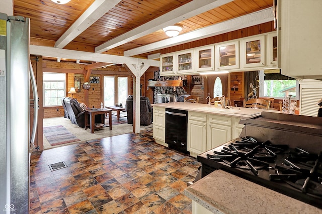 1155 Cope Rd, Martinsville, IN 46151 - kitchen with black appliances, light countertops, glass insert cabinets, a wood ceiling with exposed beams, and wooden walls