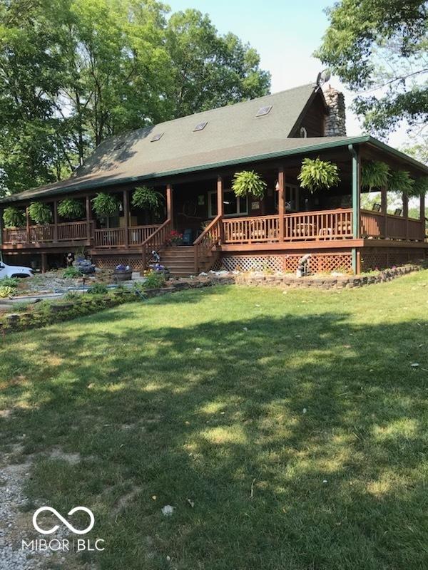 1155 Cope Rd, Martinsville, IN 46151 - view of front of house featuring a chimney, a front lawn, and a porch