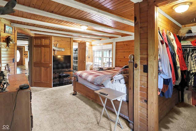 1155 Cope Rd, Martinsville, IN 46151 - carpeted bedroom featuring wooden walls, a wood ceiling with exposed beams, a closet, and a walk in closet