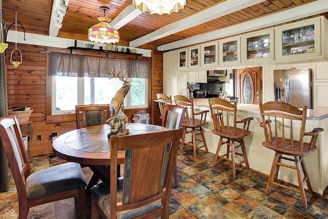 1155 Cope Rd, Martinsville, IN 46151 - dining space featuring a wood ceiling with exposed beams, dark stone finish flooring, and wood walls