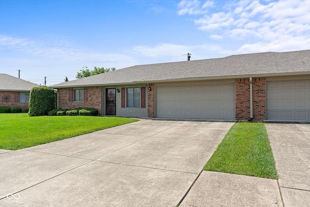 1309 Wyoming Way, Anderson, IN 46013 - ranch-style house with brick siding, concrete driveway, a front lawn, a garage, and roof with shingles