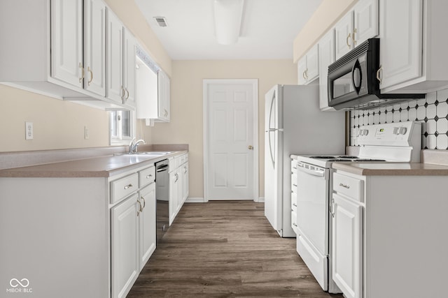 1309 Wyoming Way, Anderson, IN 46013 - kitchen featuring white range with electric stovetop, white cabinets, and dark wood finished floors