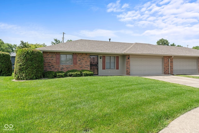 1309 Wyoming Way, Anderson, IN 46013 - ranch-style home featuring concrete driveway, brick siding, an attached garage, a front yard, and roof with shingles